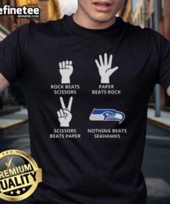 Official Seattle Seahawks T-shirt featuring 'Nothing Beats Rock Beats Scissors Paper Beats Rock Scissors Beats Paper' design.