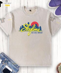 Alt Text: Official Skyline Chili Always On My Mind logo on a washed t-shirt, perfect for fans of Skyline Chili apparel.