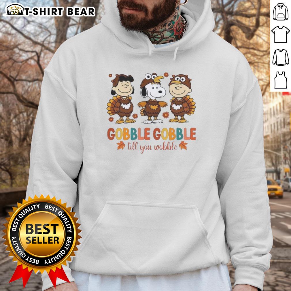 Official Snoopy And Friends Cosplay Turkey Gobble Gobble Till You Wobble Thanksgiving Hoodie Official Snoopy and Friends Thanksgiving hoodie featuring a fun turkey design, perfect for festive cosplay.