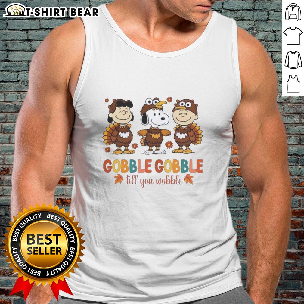 Official Snoopy And Friends Cosplay Turkey Gobble Gobble Till You Wobble Thanksgiving Tank Top Official Snoopy and Friends Thanksgiving tank top featuring a fun turkey design with 'Gobble Gobble Till You Wobble' text.