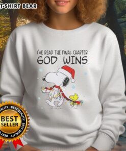 Cozy Official Snoopy X Woodstock sweatshirt with 'God Wins' text and festive Christmas lights design.