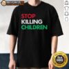 Alt Text: Official Stop Killing Children T-Shirt featuring bold text and a powerful design advocating for children's rights.