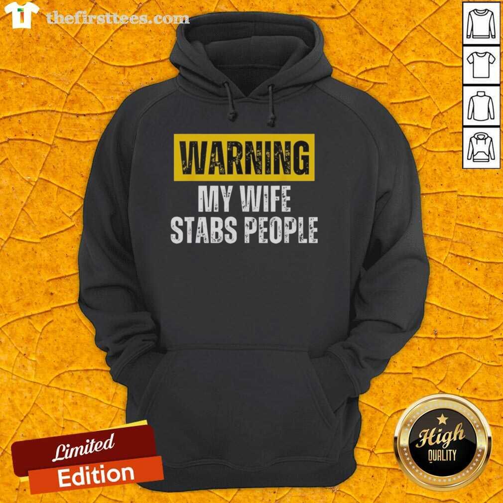 official-warning-my-wife-stabs-people-vintage-hoodie Alt Text: Vintage hoodie featuring the phrase Official Warning: My Wife Stabs People for a humorous gift idea.