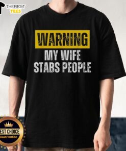 Alt Text: Official Warning My Wife Stabs People Vintage T-Shirt design featuring humorous graphic and bold text.