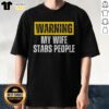 Alt Text: Official Warning My Wife Stabs People Vintage T-Shirt design featuring humorous graphic and bold text.