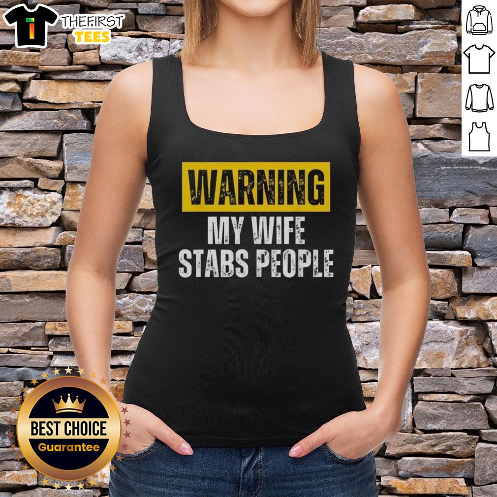 official-warning-my-wife-stabs-people-vintage-tank-top Vintage tank top featuring 'Official Warning: My Wife Stabs People' graphic, perfect for humor and unique fashion statements.