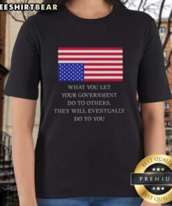 Women wearing 'What You Let Your Government Do' tee with US flag design, promoting awareness and civic responsibility.
