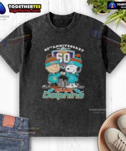 Alt Text: Original Charlie Brown fist bump with Snoopy on a Miami Dolphins skyline washed t-shirt, celebrating 60th anniversary.
