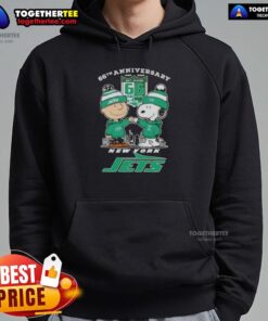 Alt Text: Original Charlie Brown fist bump with Snoopy, celebrating 66th anniversary, featuring New York Jets skyline on hoodie.