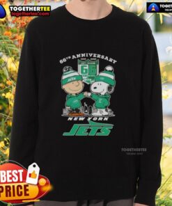 Alt Text: Original Charlie Brown Fist Bump Snoopy sweatshirt celebrating 66th anniversary with New York Jets skyline design.