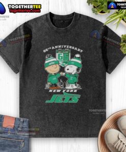 Original Charlie Brown fist bump with Snoopy graphic on a washed t-shirt, celebrating the 66th anniversary and New York Jets skyline.