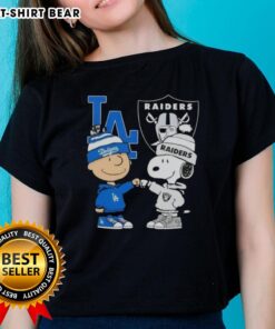 Alt Text: Original Charlie Brown fist bump with Snoopy, celebrating Los Angeles City sports, Dodgers, and Raiders on a ladies' tee.
