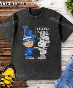 Original Charlie Brown fist bump with Snoopy on a Los Angeles sports Dodgers x Raiders washed t-shirt.
