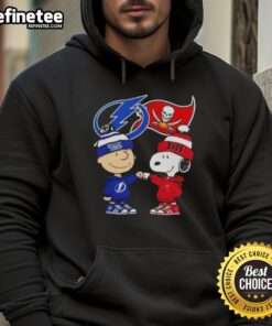 Alt Text: Original Charlie Brown Fist Bump with Snoopy on Tampa Bay Sports hoodie featuring Lightning and Buccaneers logos.
