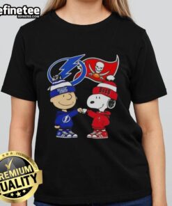 Original Charlie Brown fist bump with Snoopy on Tampa Bay sports ladies tee featuring Lightning and Buccaneers themes.