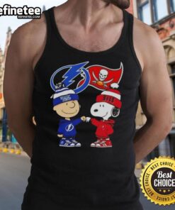 Original Charlie Brown fist bump with Snoopy on Tampa Bay sports tank top featuring Lightning and Buccaneers logos.
