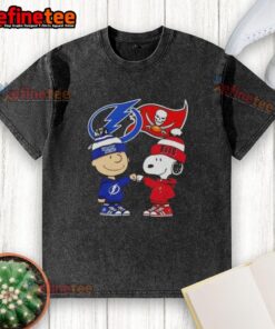Original Charlie Brown fist bump with Snoopy on a Tampa Bay Lightning x Buccaneers washed t-shirt design.