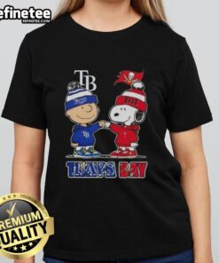 Alt Text: Original Charlie Brown fist bump with Snoopy, celebrating Tampa Bay sports - Rays and Buccaneers ladies tee design.