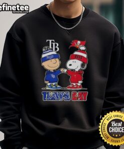 Original Charlie Brown fist bump with Snoopy on a Tampa Bay Rays & Buccaneers sweatshirt, perfect for sports fans.