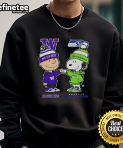 Original Charlie Brown fist bump with Snoopy on Washington Huskies x Seattle Seahawks sweatshirt design.