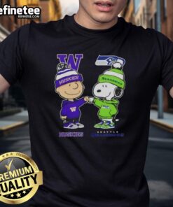 Alt Text: Original Charlie Brown fist bump with Snoopy on a Washington Huskies x Seattle Seahawks t-shirt design.