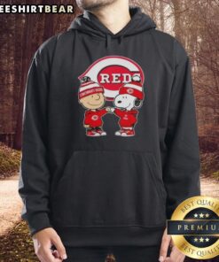 Alt Text: Original Charlie Brown fist bump with Snoopy on Cincinnati Reds hoodie, showcasing a fun and unique design.