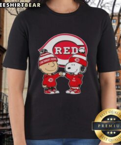Original Charlie Brown fist bump with Snoopy on Cincinnati Reds ladies tee, perfect for fans of baseball and Peanuts.