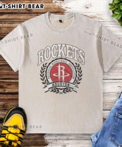 Alt Text: Retro washed t-shirt featuring the original Houston Rockets NBA logo in a laurel wreath frame design.