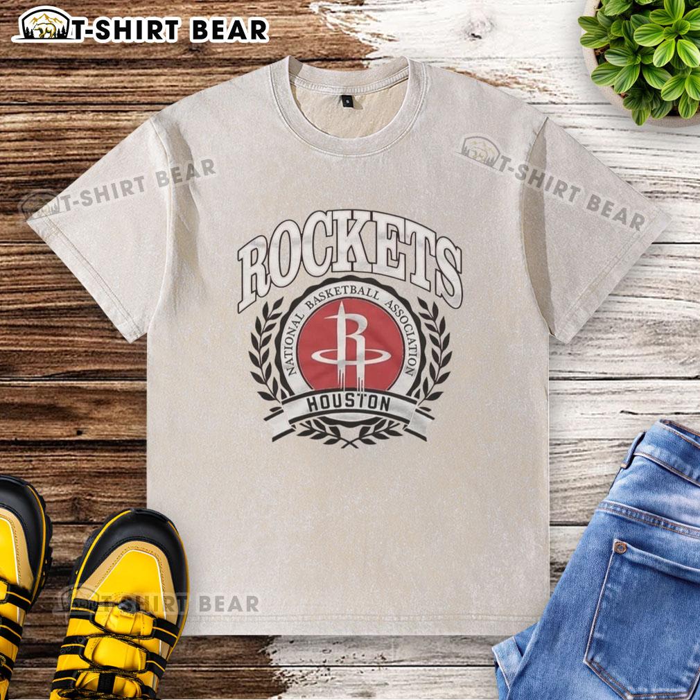 Original Houston Rockets National Basketball Association Logo Laurel Wreath Frame Retro Washed T-Shirt Alt Text: Retro washed t-shirt featuring the original Houston Rockets NBA logo in a laurel wreath frame design.