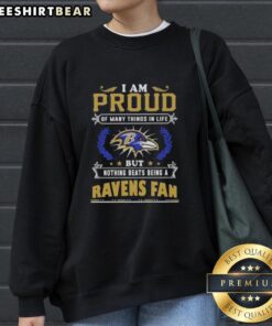 Alt Text: Baltimore Ravens fan sweatshirt with 'Proud of Many Things' slogan, perfect for dedicated supporters of the team.