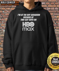 Two gay guys in hoodies at the aquarium, inspired by HBO Max, showcasing love and diversity in a vibrant setting.