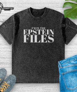 Original 'Im In The Epstein Files' washed t-shirt displayed on a hanger, showcasing its unique design and vintage style.