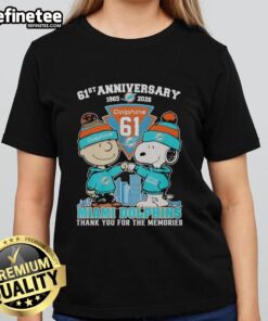 Original Miami Dolphins outfit featuring Snoopy and Charlie Brown, celebrating the 61st anniversary 1965-2026 on ladies' tee.