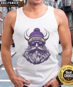 Original Minnesota Vikings mascot wearing a beanie and sunglasses, dressed in a tank top, showcasing team spirit.