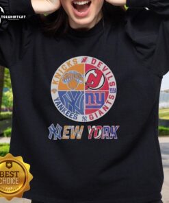 Original New York Knicks, Yankees, Giants & Devils mashup logo sweatshirt featuring vibrant team colors and designs.