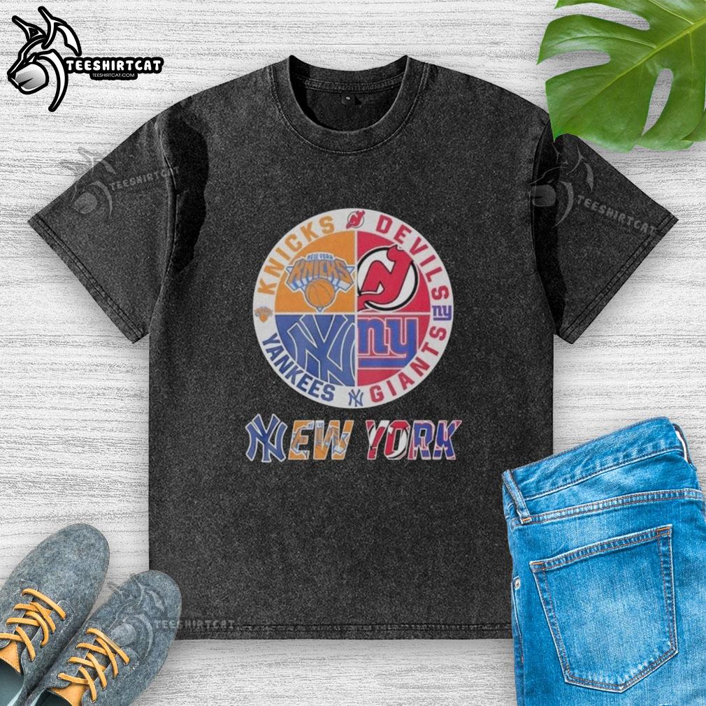 original-new-york-knicks-new-york-yankees-new-york-giants-and-new-jersey-devils-mashup-logo-washed-t-shirt Alt Text: Original New York Knicks Yankees Giants Devils mashup logo on a washed t-shirt for sports fans.