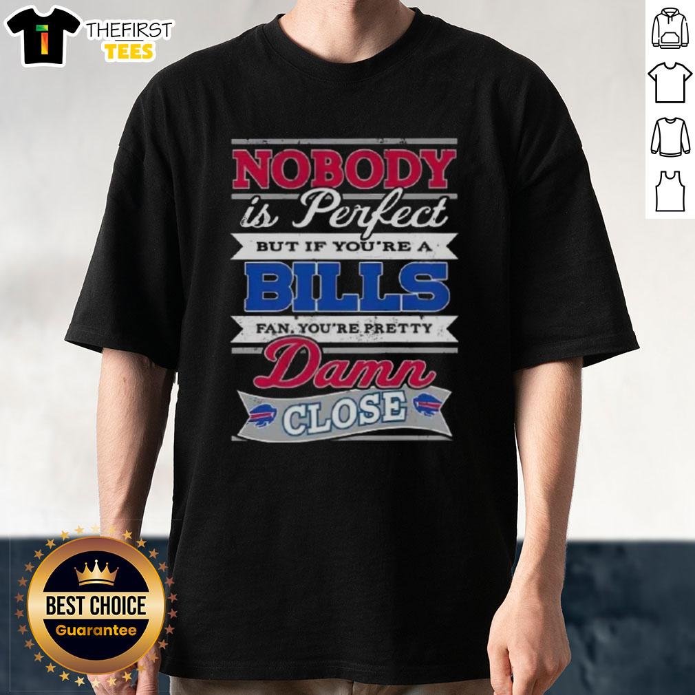 original-nobody-is-perfect-but-if-youre-a-buffalo-bills-fan-youre-pretty-damn-close-t-shirt-1 Alt Text: Original Nobody Is Perfect Buffalo Bills Fan T-Shirt design featuring bold text and team colors.