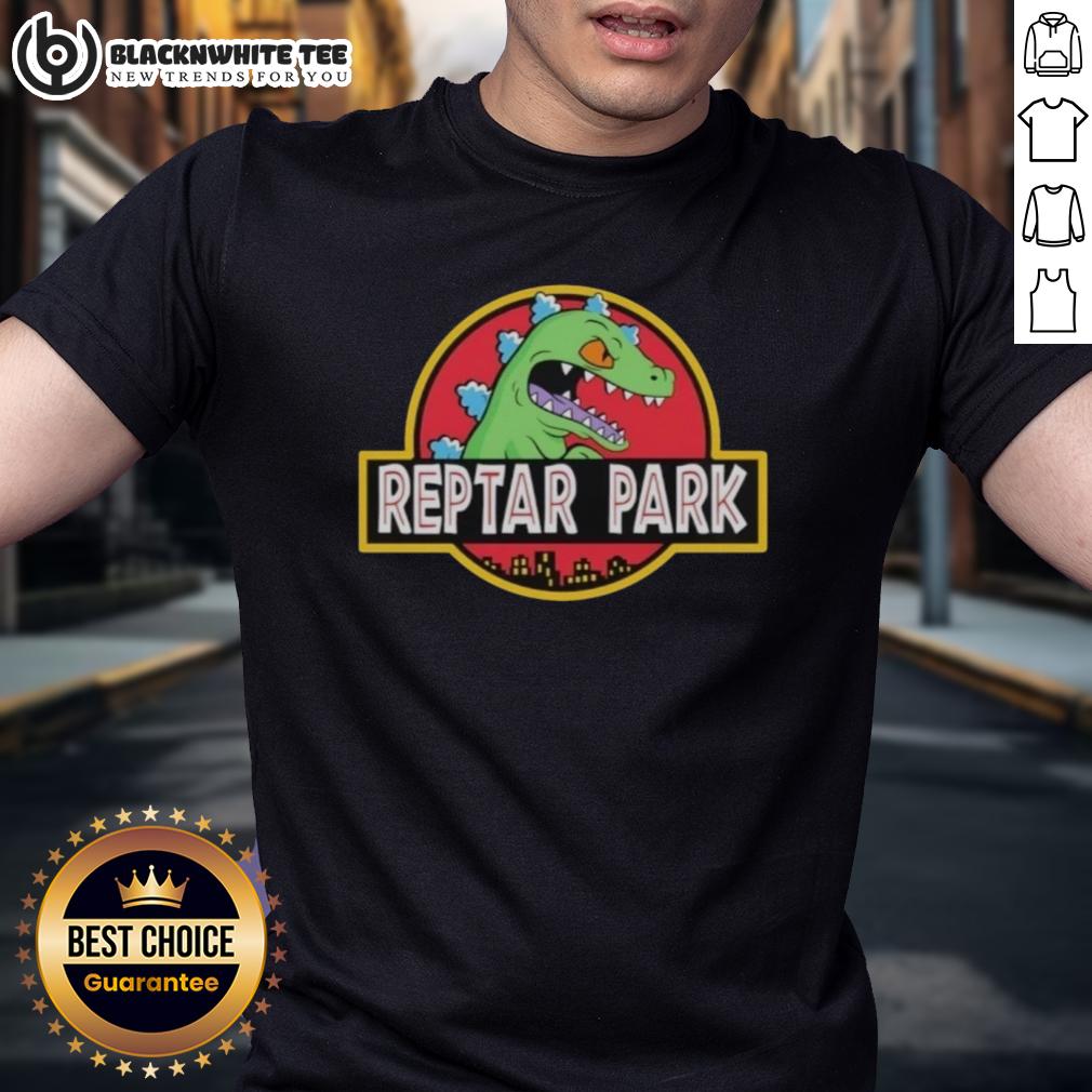 Original Reptar Park Rugrats Movie Cartoon T Shirt Original Reptar Park Rugrats Movie cartoon T-shirt featuring vibrant graphics of Reptar and classic Rugrats characters.