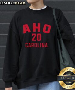 Original Sebastian Aho 20 Carolina Hurricanes hockey sweatshirt featuring team colors and logo, perfect for fans.