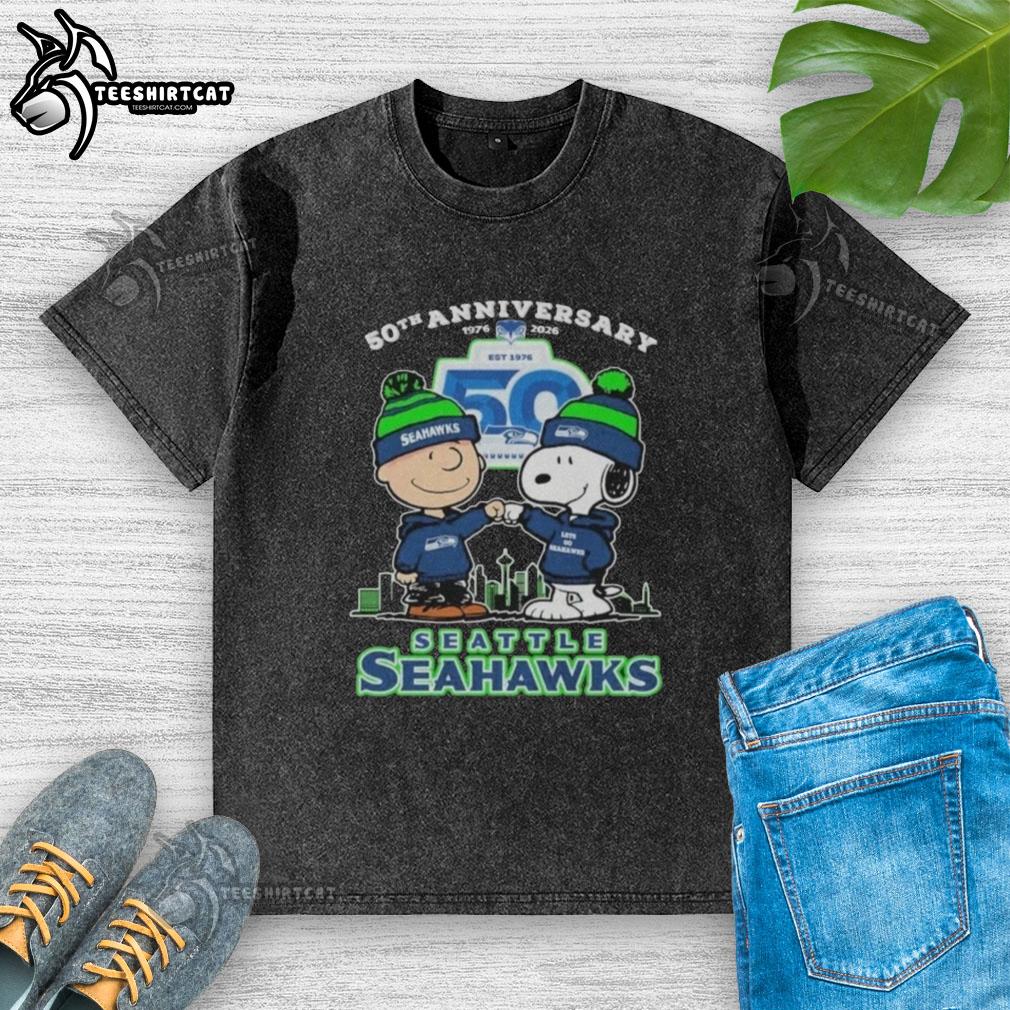 original-snoopy-and-charlie-brown-the-peanuts-seattle-seahawks-50th-anniversary-1976-2025-washed-t-shirt Alt Text: Original Snoopy and Charlie Brown Peanuts Seattle Seahawks 50th Anniversary 1976-2025 washed t-shirt design.