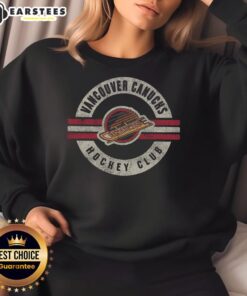 Vintage Vancouver Canucks sweatshirt featuring classic logo and cozy surround design, perfect for fans and collectors.