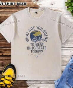 Michigan Wolverines 2025 The Game washed t-shirt with 'What Are You Doing To Beat Ohio State Today? Go Blue!' slogan.