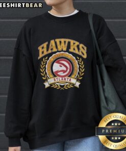 Alt Text: Premium Atlanta Hawks NBA logo in laurel wreath frame on a retro sweatshirt design, perfect for basketball fans.