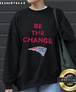Alt Text: Premium Be The Change New England Patriots sweatshirt featuring team colors and logo for ultimate fan style.
