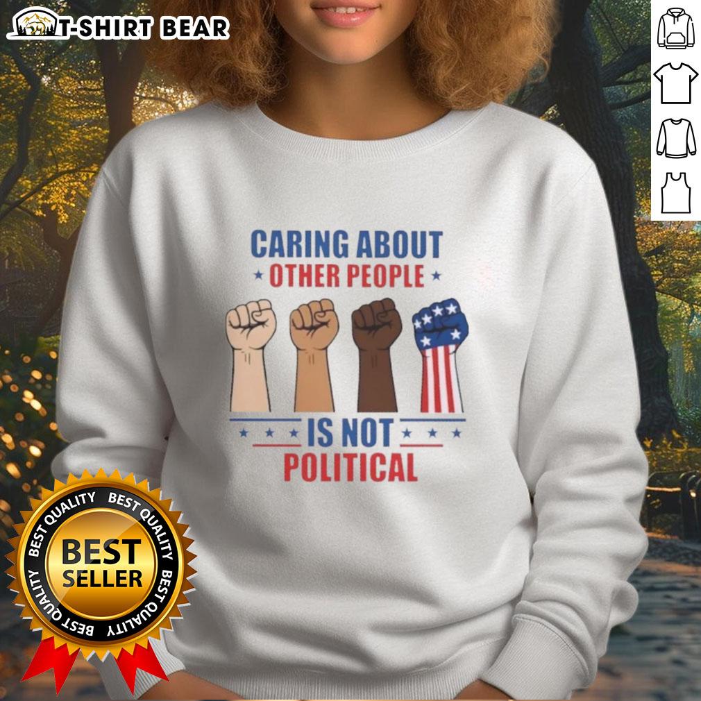 Premium Caring About Other People Is Not Political Fists Sweatshirt Premium sweatshirt with 'Caring About Other People Is Not Political' slogan, featuring bold fists design in vibrant colors.