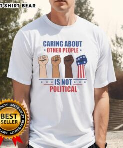 Alt Text: Premium Caring About Other People Is Not Political Fists T-Shirt featuring a bold graphic design and comfortable fit.
