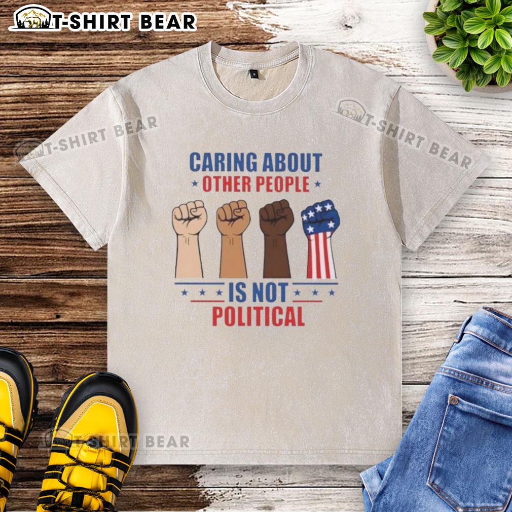 Premium Caring About Other People Is Not Political Fists Washed T Shirt Premium 'Caring About Other People Is Not Political' Fists Washed T-Shirt, featuring a bold graphic design on a soft fabric.
