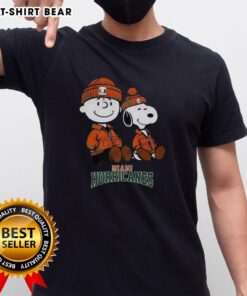 Premium Charlie Brown and Snoopy Miami Hurricanes T-Shirt featuring vibrant graphics and a comfortable fit for fans.