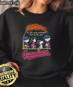 Alt Text: Premium Cleveland Guardians X Peanuts Snoopy and Friends sweatshirt, perfect for autumn and celebrating the season's joy.
