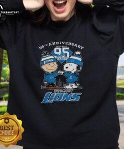Alt Text: Premium Detroit Lions 95th Anniversary sweatshirt featuring Charlie Brown and Snoopy, celebrating One Pride in 2025.